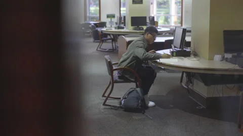 College Student Doing Homework at Desk with Computer Video stock 208710405