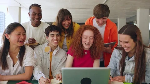 College student group working together on laptop for an university assignment Stock Footage 243733688