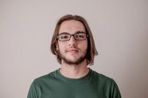 College student guy looking at camera, smiling young boy with eyeglasses Stock Photos