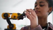 College Student Holding Her Robotic Toy At Robotics Classroom At School. Stock Footage