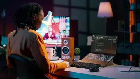 College student learning about outsourcing with html script, Stock Footage 265195220