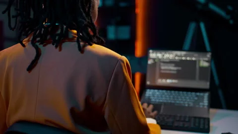 College student learning about outsourcing with html script, Stock Footage 265337793