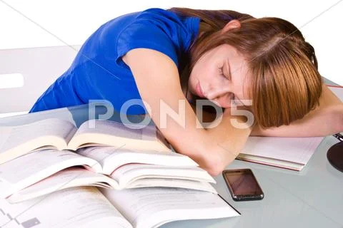College student sleeping on her desk Stock Photos