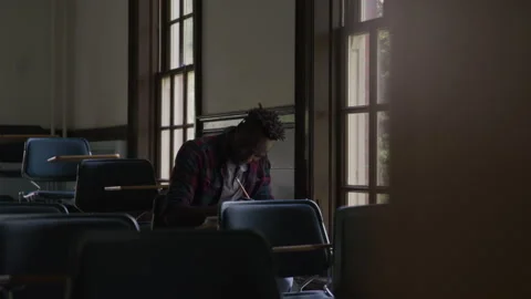 College Student Solving Problems In Classroom Stock Footage 210220596