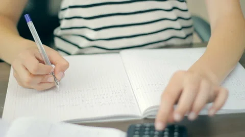 College student studying and doing homework in her room, close-up Stock Footage