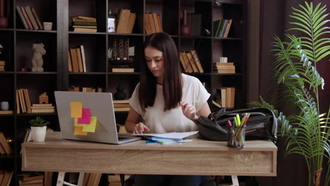College student using laptop computer watching online distance learning seminar Stock Footage 304930889