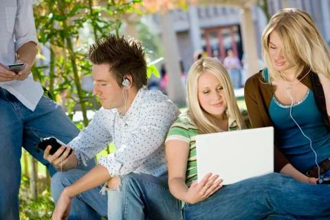 College Student Using Technologies On Campus Stock Photos