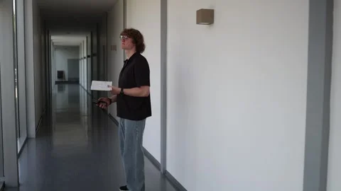 College student walks reading notes Video stock 338277012