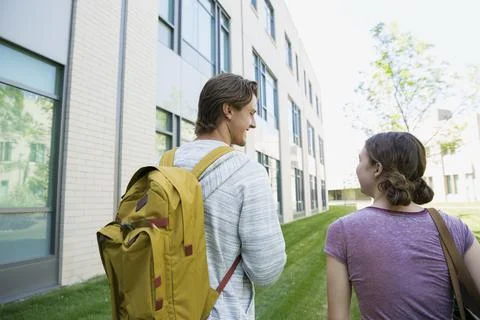College students with backpack walking on campus Stock Photos