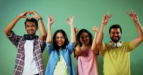 College students cheering with hand gestures like heart, okay and thumbs up Stock Footage 342383969