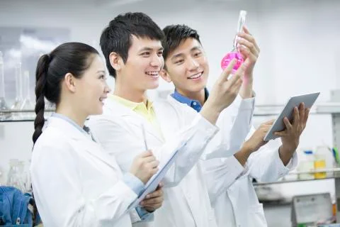 College students doing experiment Stock Photos