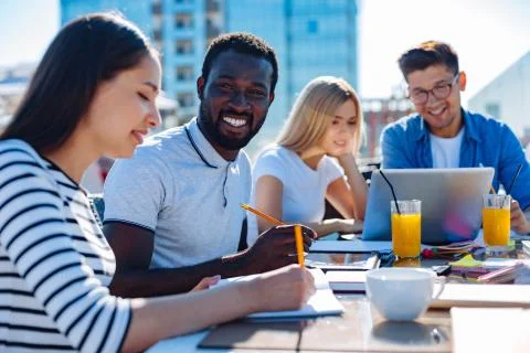 College students doing home assignment outdoors Foto stock
