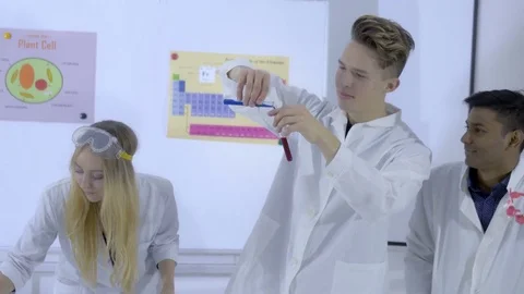 College students making chemistry experiments in science class Stock Footage 74623457
