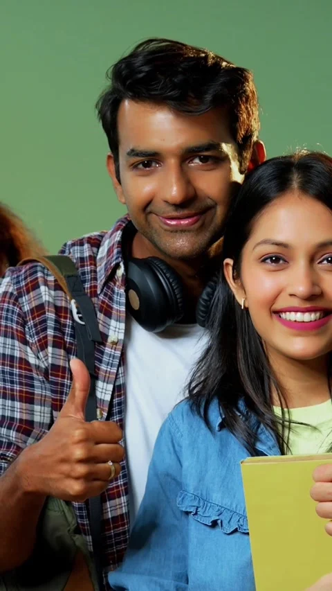 College students show thumbs up while smiling at camera, standing indoors Stock Footage 342385056