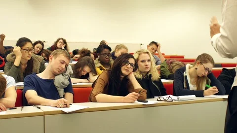 College Students sleeping / asleep in class in University Lecture Hall Classroom Stock Footage 128514084