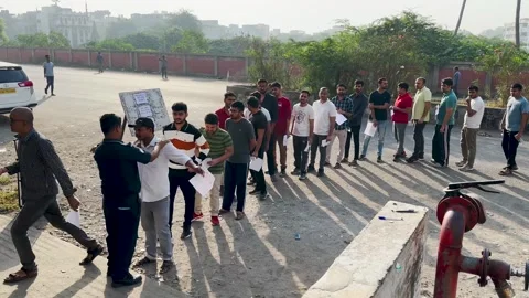 College students standing in queue outdoors near exam center. Stock-Footage 254473938