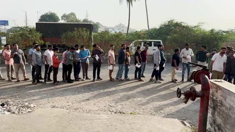 College students standing in queue outdoors near exam center. Stock Footage 254538050