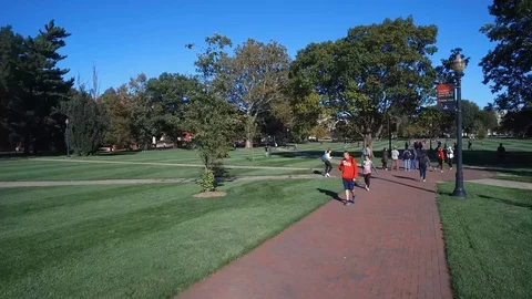 COLLEGE STUDENTS, STUDENTS WALKING ON SIDEWALK Stock Footage 98562452