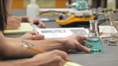 College students take notes during a chemistry lab class Stock Footage 33881256
