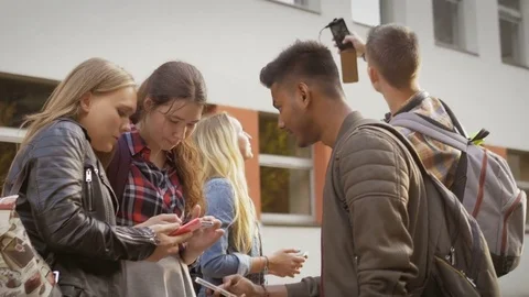 College students using their mobile phones Stock Footage 74567252