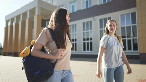 College students walking. students with backpacks enjoying education. learners Stock-Footage 311632579