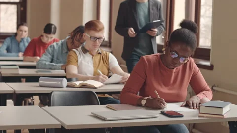 College Students Writing Test in Class Stock Footage 236107844