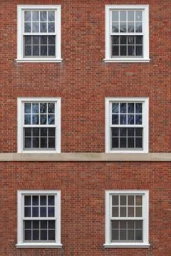 College windows on brick wall Stock-Fotos
