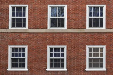 College windows on brick wall Stock Photos