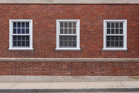 College windows on brick wall Stock Photos