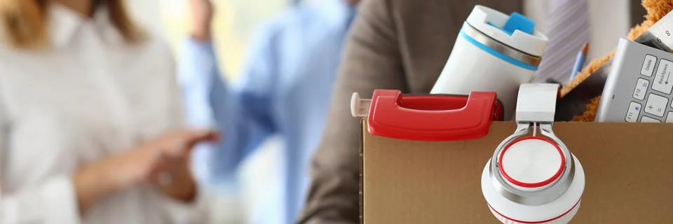 Collegues feeling happy while man becoming unemployed Stock Photos