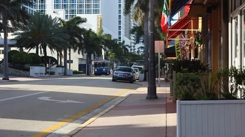 Collins Ave and 71st slow motion morning commute Stock Footage 50586358