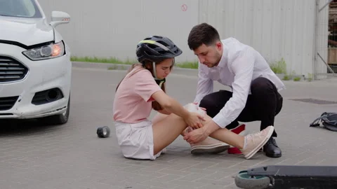 Collision between car electric scooter aftermath accident caution on roads Stock Footage 274415070