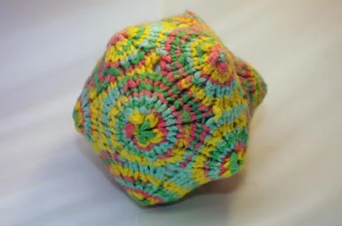 Coloful knitted yarn polygon math-toy (Macro detail) Stock Photos