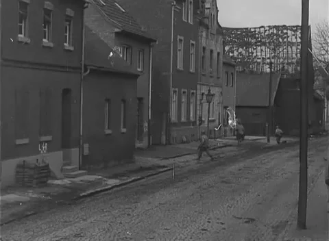 COLOGNE - 1945: Street entry - Armor Waits Beyond Shuttered Houses Stock Footage 344493429