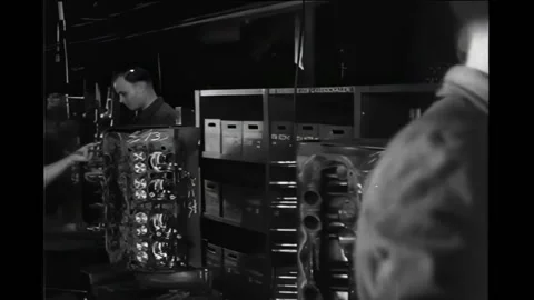 COLOGNE - 1948 - Workers assembling pistons and rings. Car engines are being Vídeos de archivo 308101641