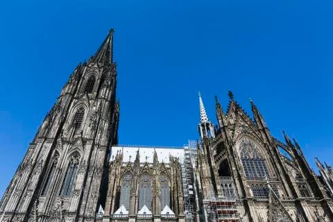 Cologne Cathedral low angle view from the side with blue sky Stock Photos