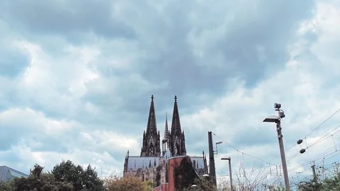 Cologne Cathedral Spires Beyond Railway Tracks and Wires Stock Footage 345653606
