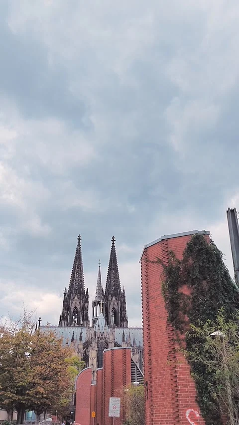 Cologne Cathedral Spires Beyond Railway Tracks and Wires Stock Footage 345653691