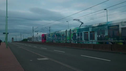 Cologne, Germany - 1 August 2023: Deutzer Brucke bridge with tram and motorbike Stock Footage 311997977