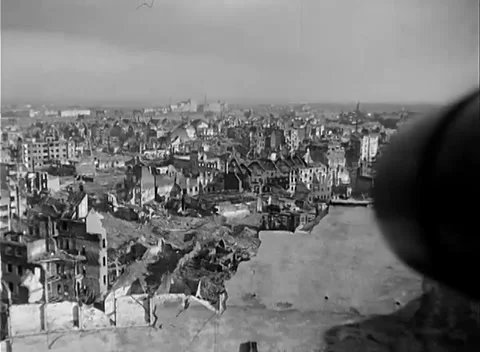 COLOGNE, GERMANY - 1945: Apartment shells - pan reveals concrete roof and sheds 스톡 동영상 344598497