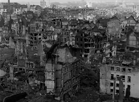 COLOGNE, GERMANY - 1945: Brick facades - blown windows and timbers fill blocks Stock Footage 344598511