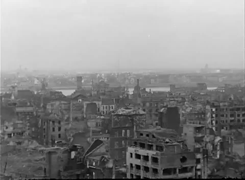 COLOGNE, GERMANY - 1945: Collapsed roofs - hollow shells line a river panorama 스톡 동영상 344598532