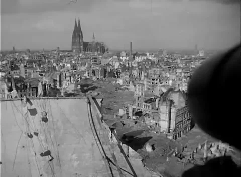 COLOGNE, GERMANY - 1945: Distant cathedral - cables litter the rooftop terrace 스톡 동영상 344598494