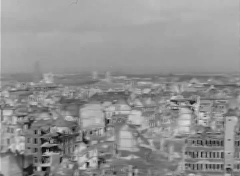 COLOGNE, GERMANY - 1945: Distant skyline - faint towers rise past a hollow block 스톡 동영상 344598477