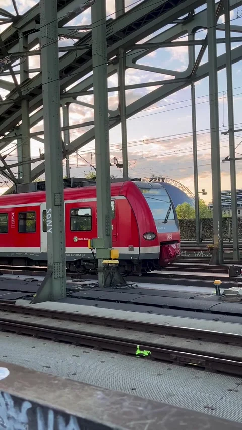Cologne, Germany, May 17, 2025: A modern high-speed train traveling across Stock Footage 309566392