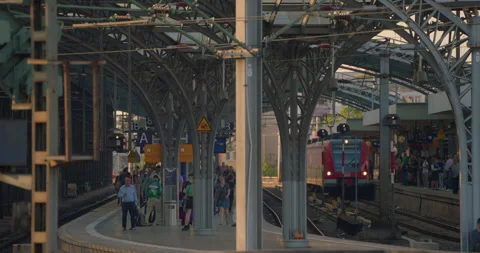Cologne, Germany Passengers waiting train on railway station. Transportation Stock Footage 250086001