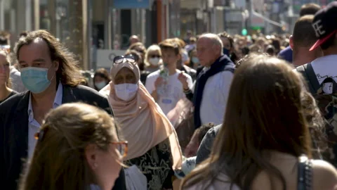 COLOGNE, GERMANY, SEPTEMBER 2020: Packed High Street Shopping Crowd during pa Stock Footage 237526359