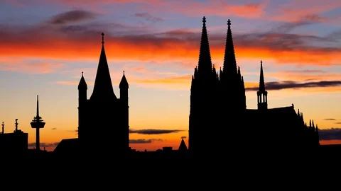 Cologne: Skyline with Cathedral and Great St. Martin Church in silhouette Stock Footage 119893089