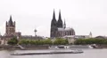 Cologne Skyline Landmarks Rhine River Cargo Ship Passing Barge Freight Transport HD Footage