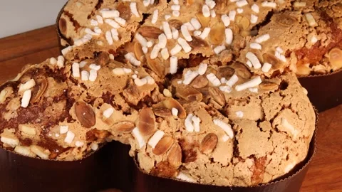 Colomba Easter cake with almonds and sugar on wooden board for holiday Vídeo Stock 306156513